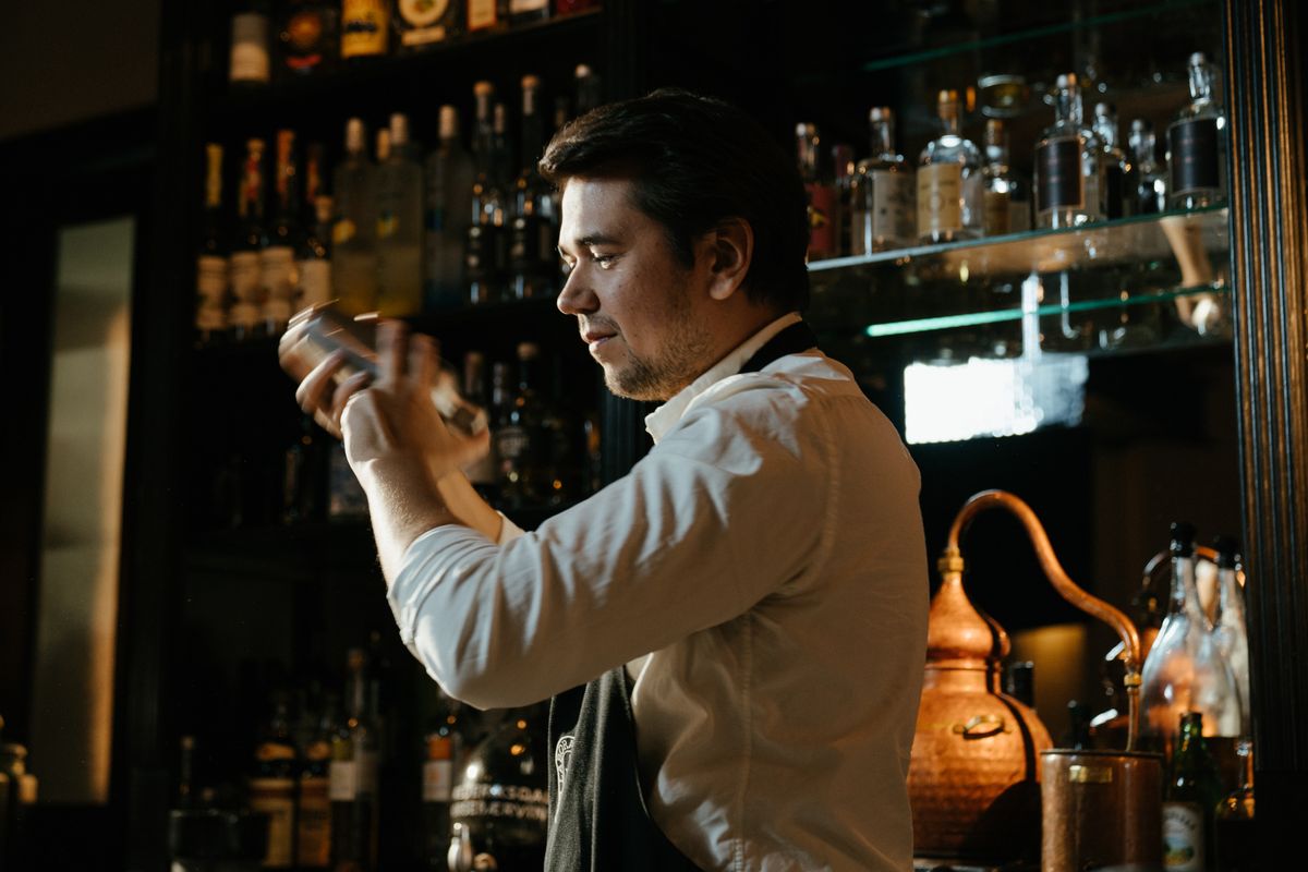 Bartender shaking a cocktail